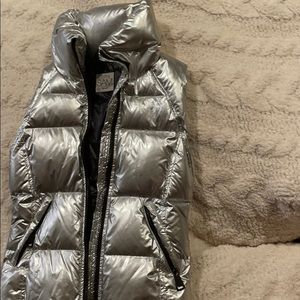 a silver shiny sam vest!!!